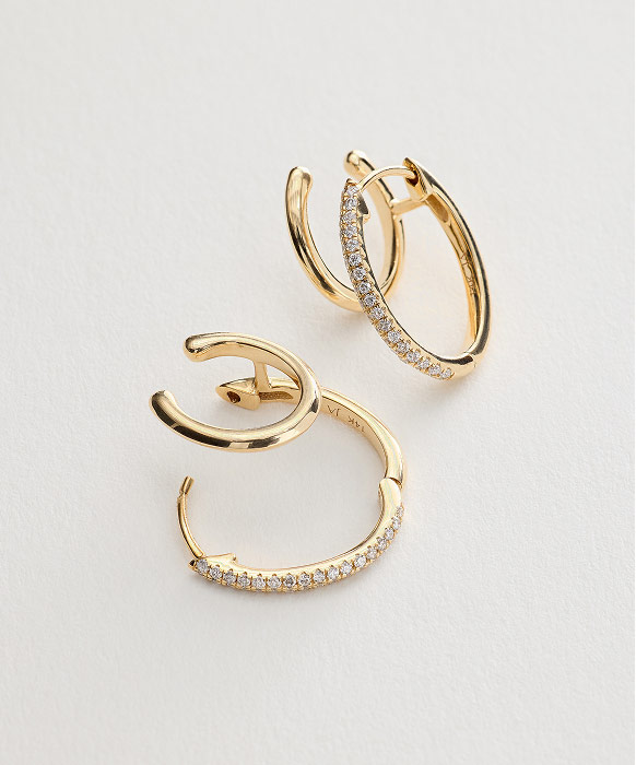 14K yellow gold and diamond split hoop and ear cuff earrings.