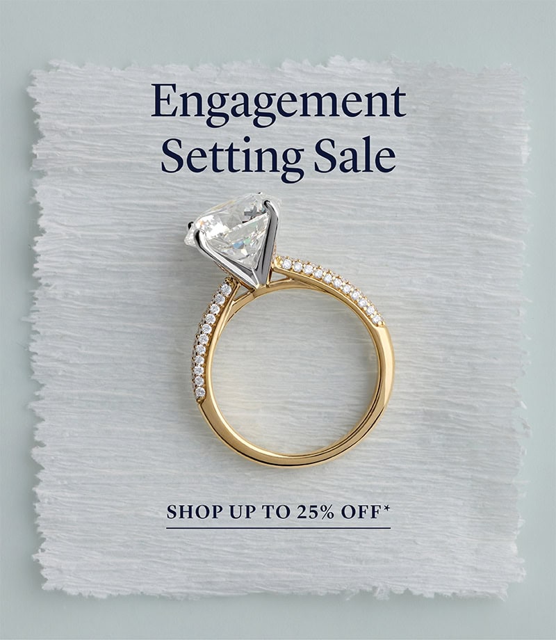 Gold engagement ring on handmade paper with 'Engagement Setting Sale' text and a 'Shop Up To 25% Off*' offer.