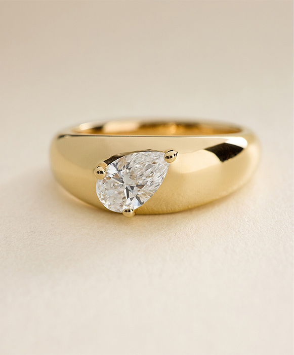 James Allen collection at Blue Nile featuring a pear diamond in a modern yellow gold chunky ring
