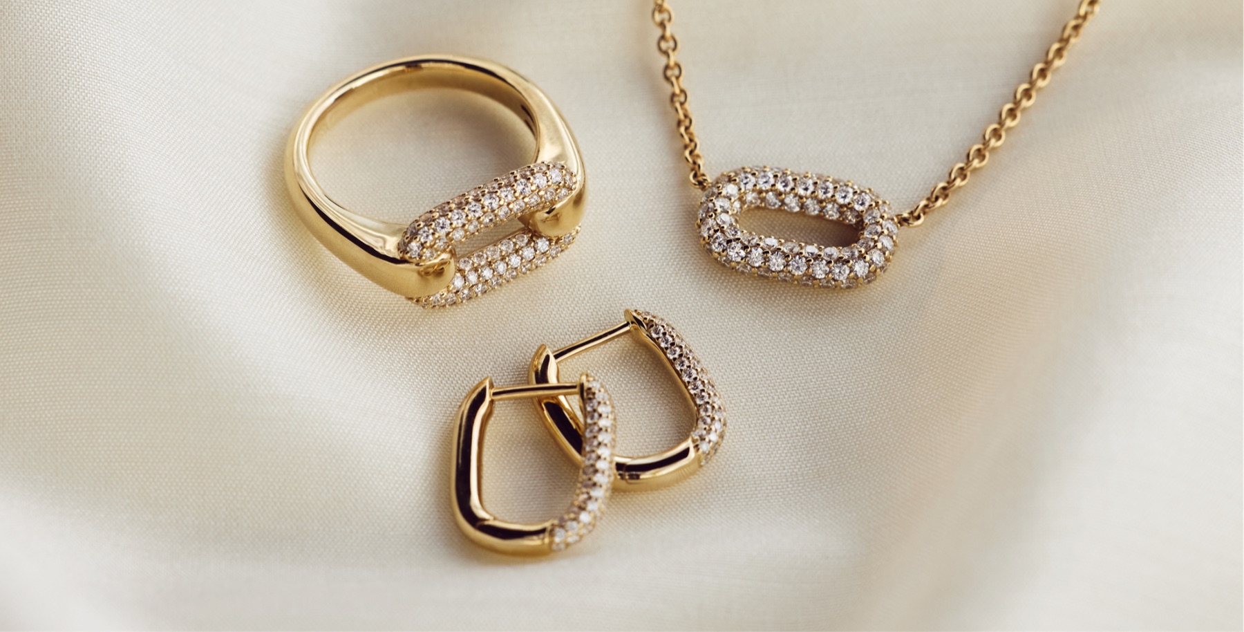 Ellipse collection diamond jewelry ring necklace and earrings in 14k gold with pavé oval design Blue Nile